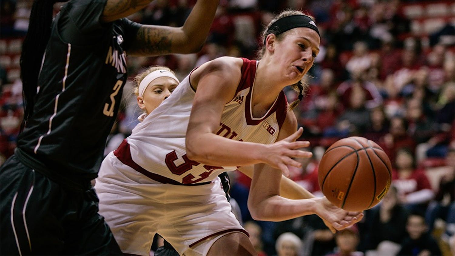 Sophomore forward Amanda Cahill reaches for the ball before it goes out of bounds. IU defeated Minnesota 93-79 Feb. 18.