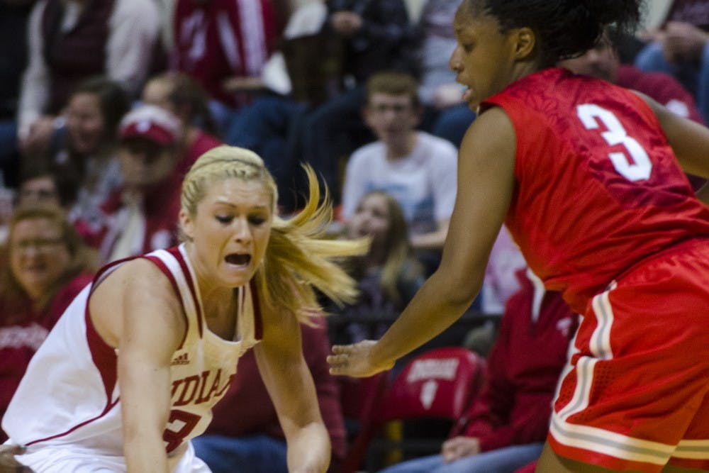 Freshman guard Tyra Buss drops the ball after being fouled by a pressuring Ohio State defense during the Hoosier's game on Thursday at Assembly Hall. Indiana lost 103-49 and will play its next home game against Wisconsin on Saturday.