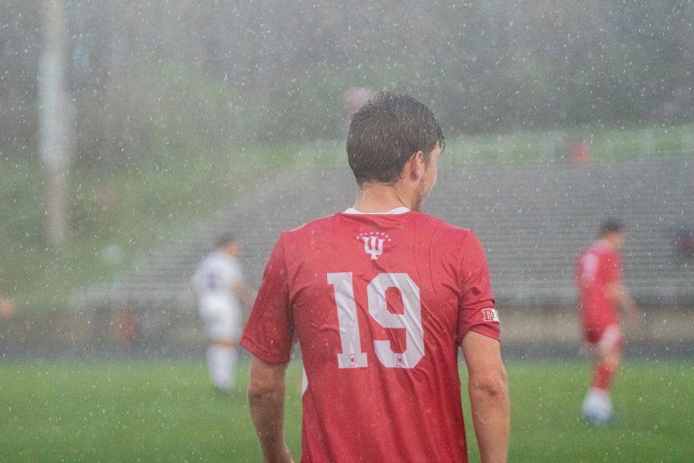 <p>The rain pours down on then-sophomore defender Brett Bebej April 10, 2021, at Bill Armstrong Stadium. The IU men&#x27;s soccer game against the University of Notre Dame scheduled for Saturday night has been postponed to a yet to be determined date.</p>