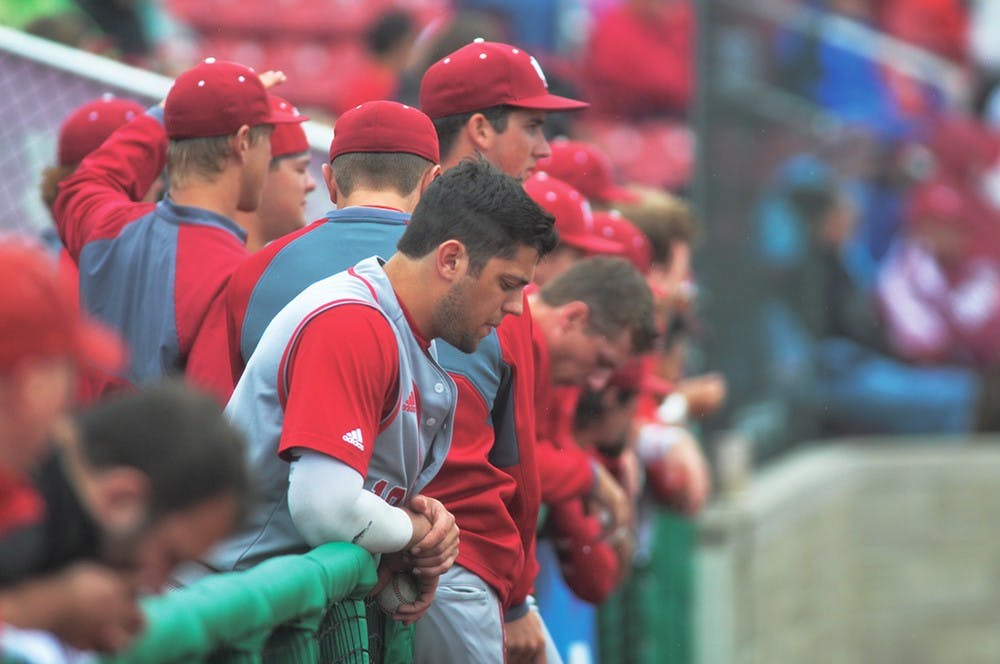 The Hoosiers watch the final outs of the ninth inning from the dugout on Wednesday as Minnesota secures a 5-4 victory in game one of the Big Ten Tournament.