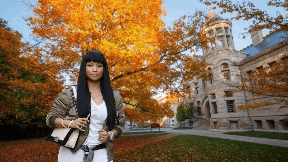 Nicki Minaj is seen edited onto a photo of IU&#x27;s campus. Edited photos of Minaj have become a niche favorite for followers of the @iubarbz Instagram account.