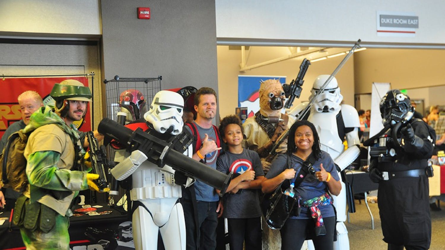 Visitors take photos with cosplayers potraying  Star Wars characters at the Indiana Toy and Comic Expo that took place at the Monroe County Covention Center Sunday afternoon. 
