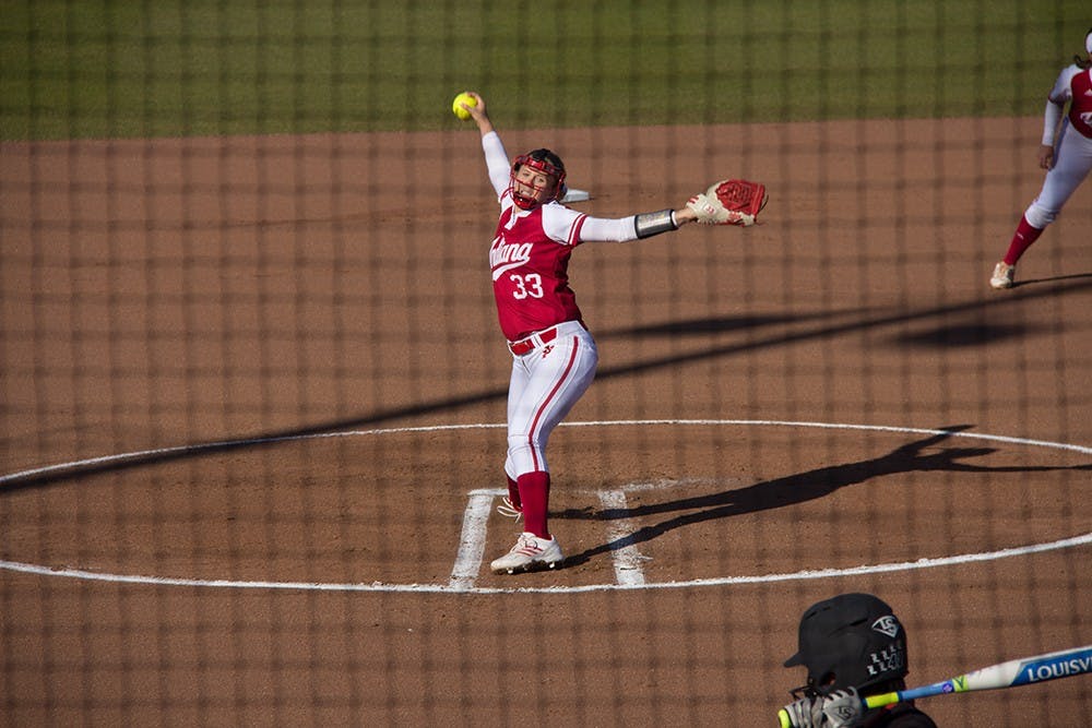 Freshman pitcher Tara Trainer throws a pitch during Tuesday againsts University of Louisville at Andy Mohr Field. IU lost agianst University of Louisville 2-12.