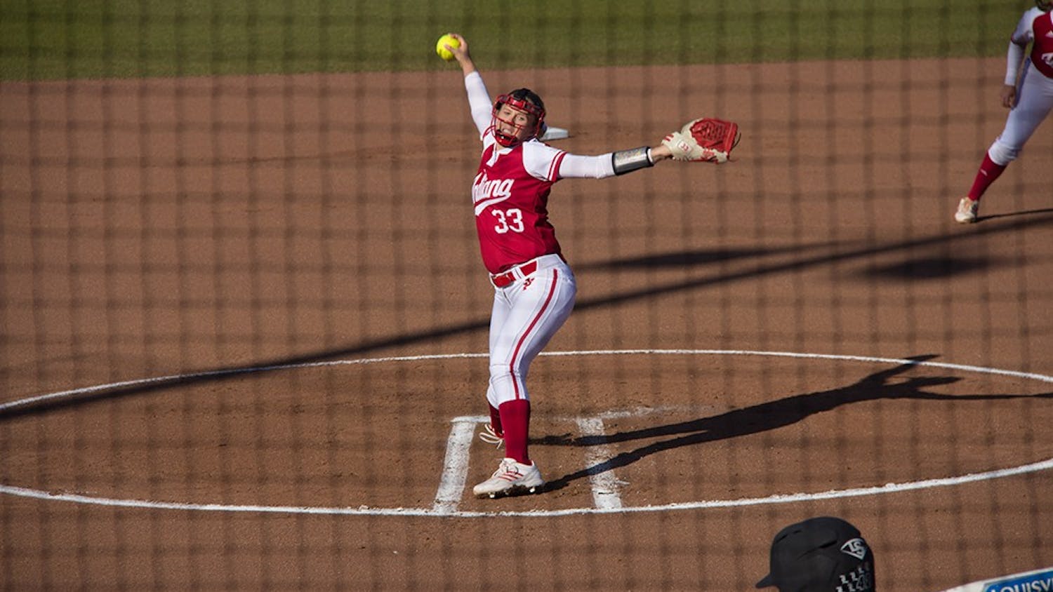 Freshman pitcher Tara Trainer throws a pitch during Tuesday againsts University of Louisville at Andy Mohr Field. IU lost agianst University of Louisville 2-12.