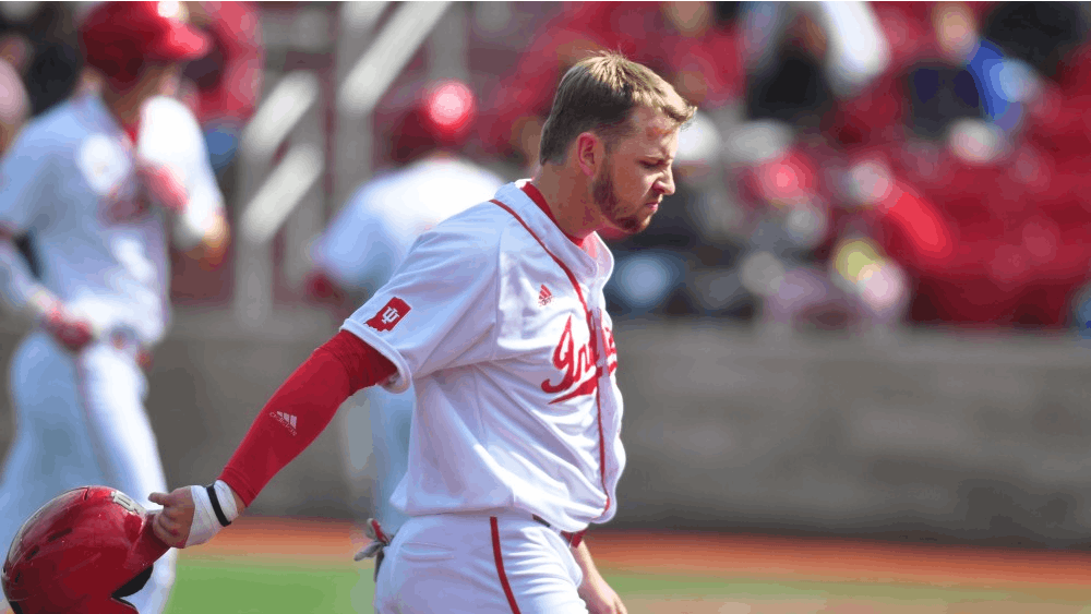 Then-sophomore, now junior infielder Matt Lloyd walks back to the dugout after a double play ends the Hoosiers’ scoring chance in the ninth inning against Nebraska on April 1, 2017. Lloyd and the Hoosiers split their Saturday doubleheader against San Diego.&nbsp;