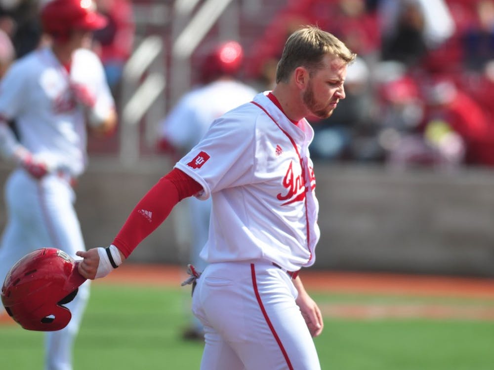 Then-sophomore, now junior infielder Matt Lloyd walks back to the dugout after a double play ends the Hoosiers’ scoring chance in the ninth inning against Nebraska on April 1, 2017. Lloyd and the Hoosiers split their Saturday doubleheader against San Diego.&nbsp;