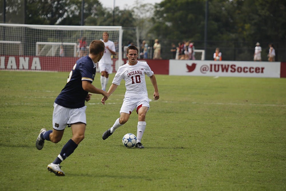 Junior Midfielder Tanner Thompson dribbles the ball during IU's game against Notre Dame Sunday, August 30th at Bill Armstrong Stadium. IU lost 0 to 1 after Notre Dame scored a goal during the second overtime of the game. 