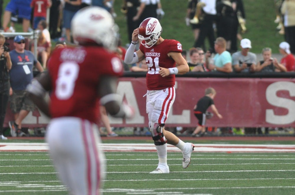 Junior quaterback RIcahrd lagow walks off the field at Memorial Stadium on Saturday after throwing an inteception in the 4th quarter, one of five he through in the game. IU lost to Wake Forest 33-29.