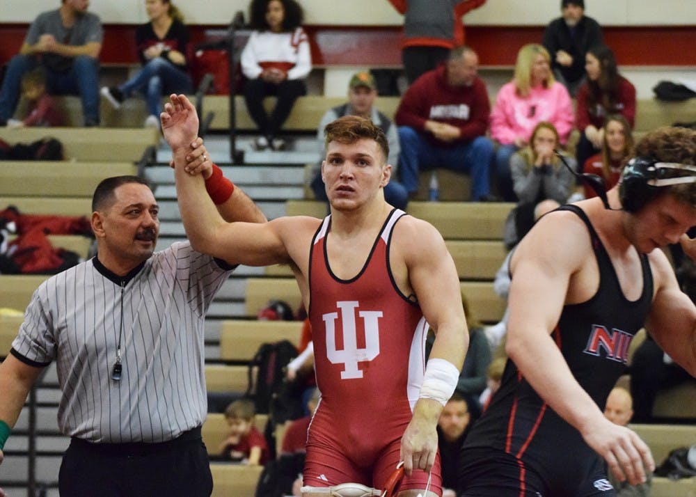 Sophomore Devin Skatzka takes down his opponent with a pin early in the match in the 174-pound category during the Hoosier Duals at the University Gym on Dec. 2. Skatzka finished in eighth place in the 174 lb. division at last week's 55th Ken Kraft Midlands Championships.