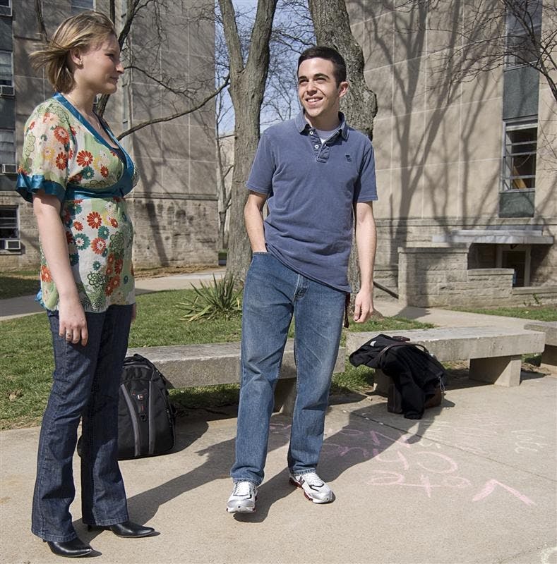 Hoosier Compass presidential candidate and IU senior Jessica Schul talks with sophomore web page designer Jared Solow Tuesday afternoon in Ashton Center. The Residence Hall Association conducted a re-election on Tuesday, pitting Hoosier Compass against the Chuck Norris ticket, three weeks after the original election.