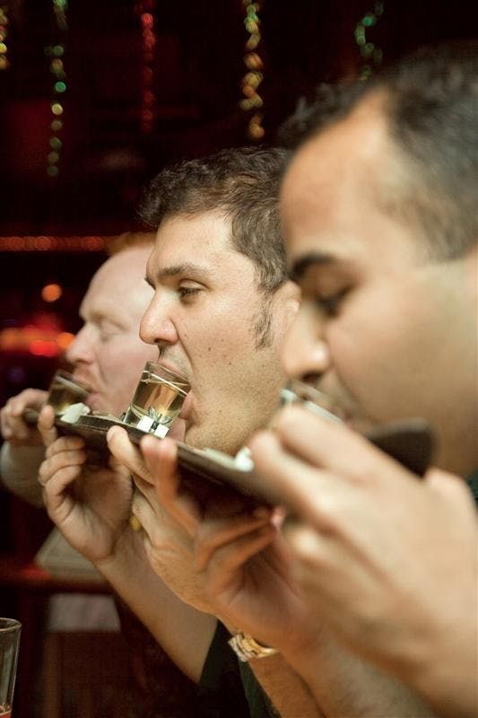 Then MBA students Chris Osos, John Lash and Ritesh Bhattacharya enjoy a shotski April 9, 2007 at Yogi's during Dyngus Day. 