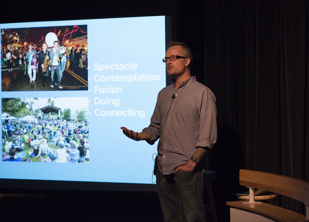 Dr. David McDonald, associate professor of folklore and ethnomusicology at IU, presents a few of the bands that will perform at the Lotus festival this year. McDonald's presentation at the Monroe County Public Library Tuesday night included samples from the lesser known bands and an overview of the festival's goals. 