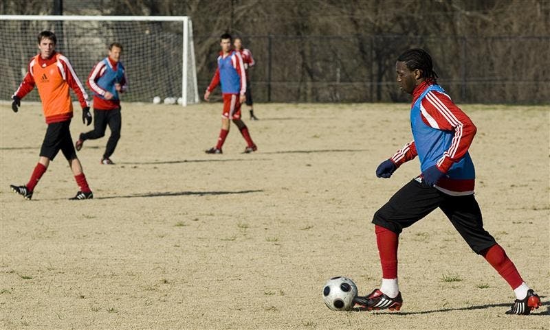 Senior back Ofori Sarkodie dribbles the ball across the pitch April 8 at the soccer practice fields. The Hoosiers face Cincinnati and IUPUI in a double header today at Bill Armstrong Stadium.