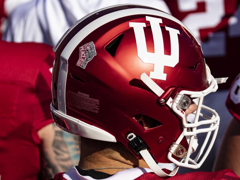 An Indiana football player wears an IU helmet Oct. 24, 2020, in Memorial Stadium. Indiana will face off against Ohio State in Saturday&#x27;s season opener. 