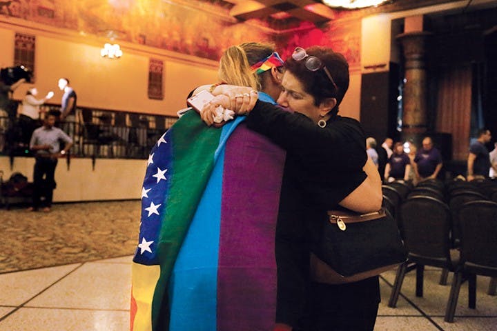 Kim Saylor, left, hugs Annette Gross, right, after the end of a vigil, which took place in the Egyptian Room at the Old National Centre Sunday evening and was sponsored by Indy Pride in response to the recent mass shooting that took place at a gay night club in Orlando, Florida. "I wouldn't have been anywhere but here today," Saylor said. "The hate has got to end." 