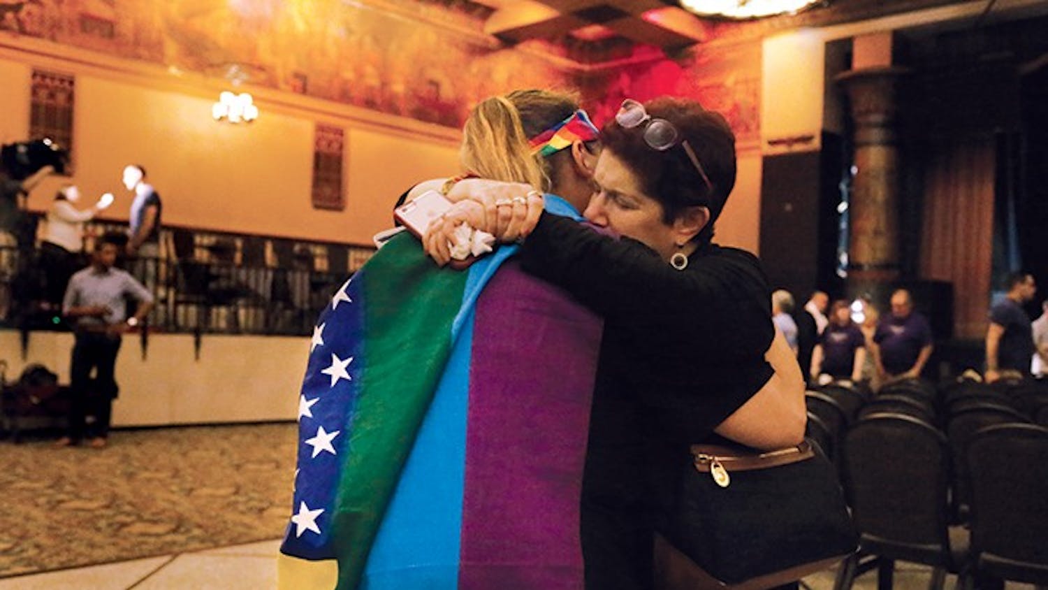 Kim Saylor, left, hugs Annette Gross, right, after the end of a vigil, which took place in the Egyptian Room at the Old National Centre Sunday evening and was sponsored by Indy Pride in response to the recent mass shooting that took place at a gay night club in Orlando, Florida. "I wouldn't have been anywhere but here today," Saylor said. "The hate has got to end."