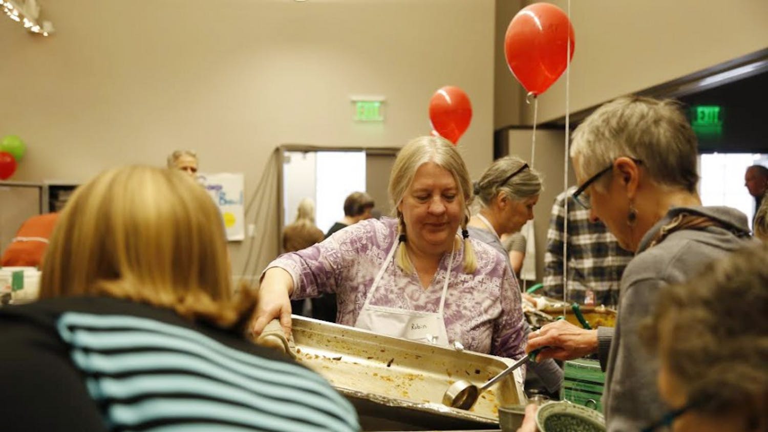 Robin Menzyka, a volunteer at the 24th Annual Soup Bowl Benefit, serves soup for attendees Sunday, Feb. 18. The soup bowl is a fundraising opportunity for Hoosier Hills Food Bank that served soup from 42 local business this year.&nbsp;