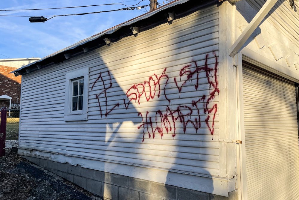 <p>A swastika is seen Dec. 13, 2021 on the side of a garage near First and Grant streets. This is the fourth swastika found in Bloomington in the last three weeks.</p>