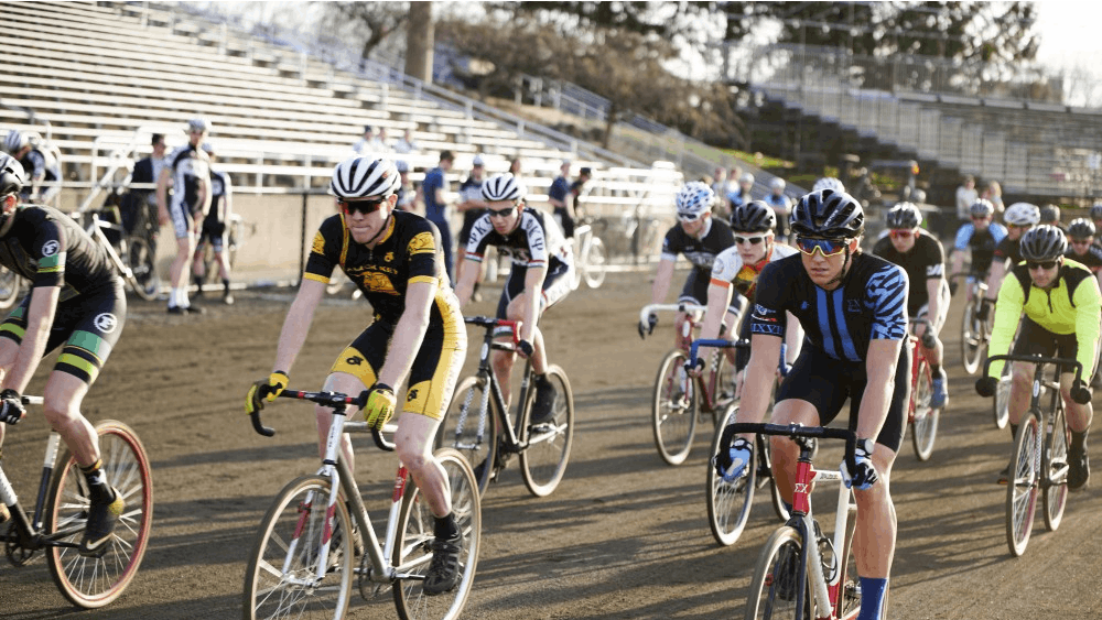 Participants race around the track to complete 50 laps during a practice session for Little 500 on Thursday evening at Bill Armstrong Stadium.
