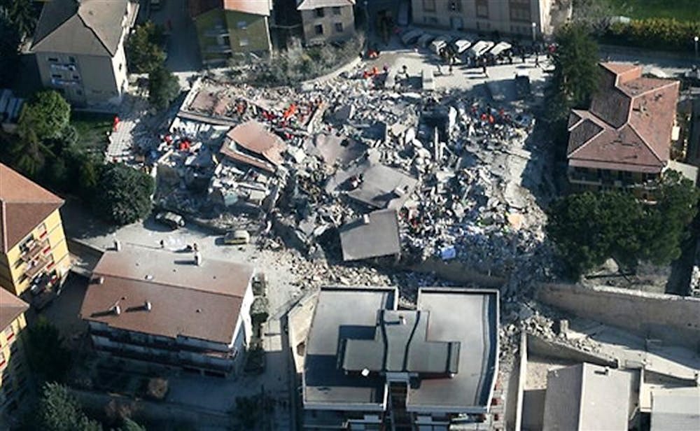 This aerial photo provided by the Italian Police shows the debris of a collapsed building in an area near L'Aquila, central Italy, after a powerful earthquake shook central Italy, early Monday, April 6, 2009. 