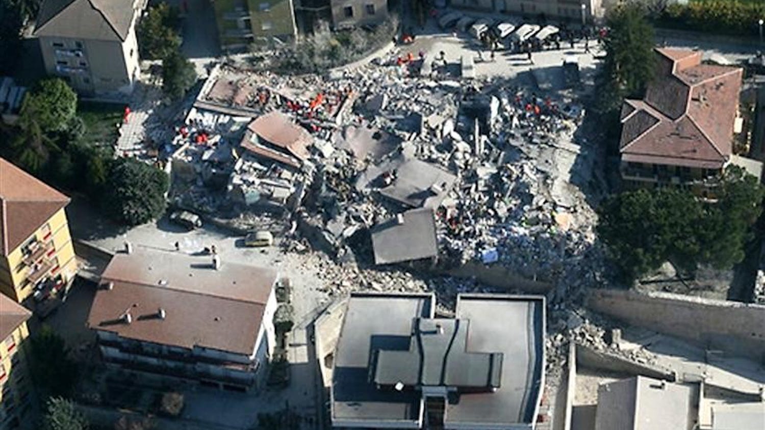 This aerial photo provided by the Italian Police shows the debris of a collapsed building in an area near L'Aquila, central Italy, after a powerful earthquake shook central Italy, early Monday, April 6, 2009. 