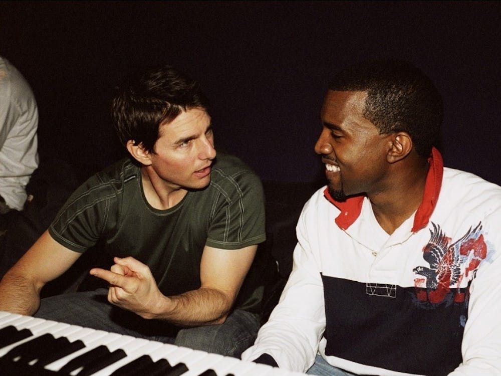 Kanye West is pictured with Tom Cruise.