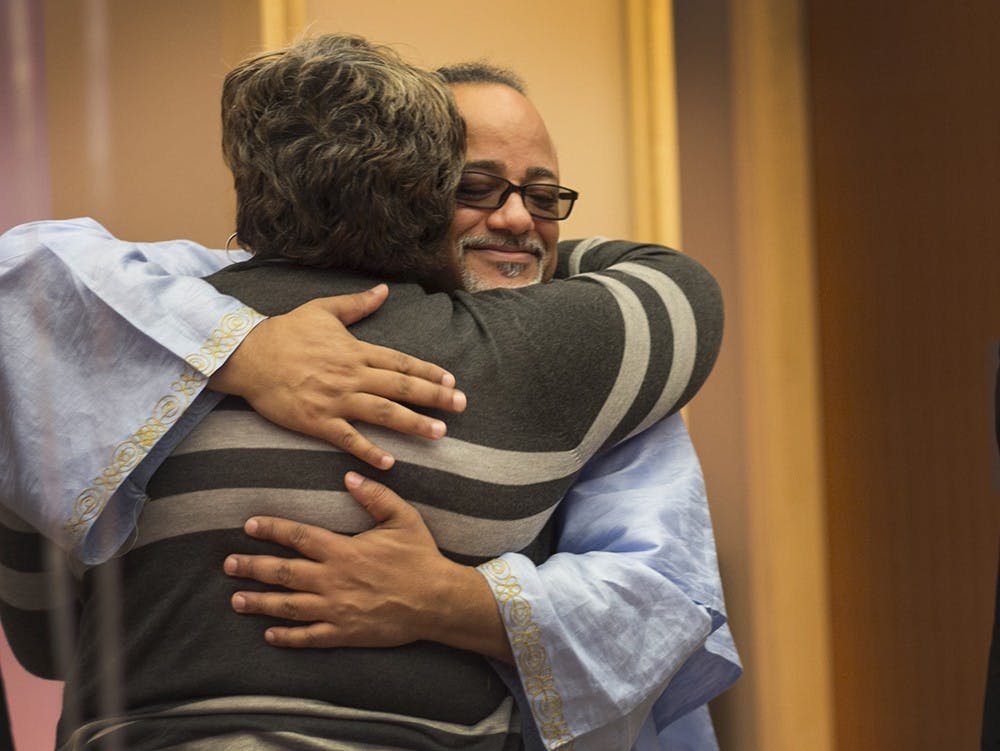 Eric Love, Director of the IU Office of Diversity Education hugs guests at his going-away celebration Sunday at Neal Marshall Center's Grand Hall. Love has been the director of the Office of Diversity Education for 10 years and will be leaving to become the director of staff of Diversity and Inclusion at Notre Dame. 