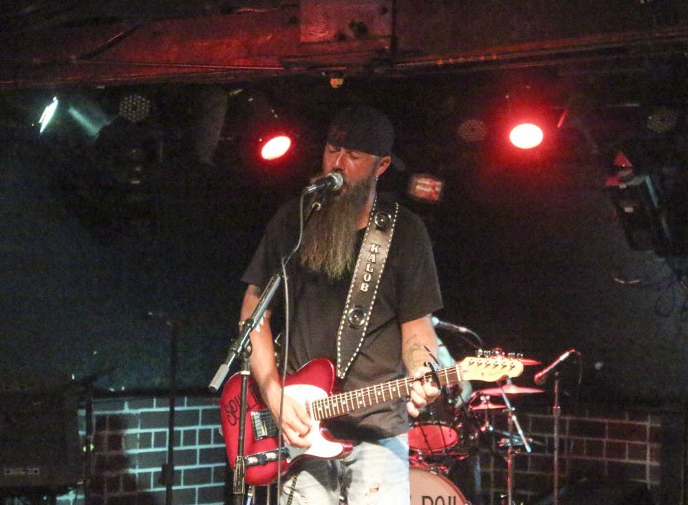 Dustin Day, a member of Trigger Happy, performs Saturday night at the Bluebird. The band performed with the Split Rail the same night.