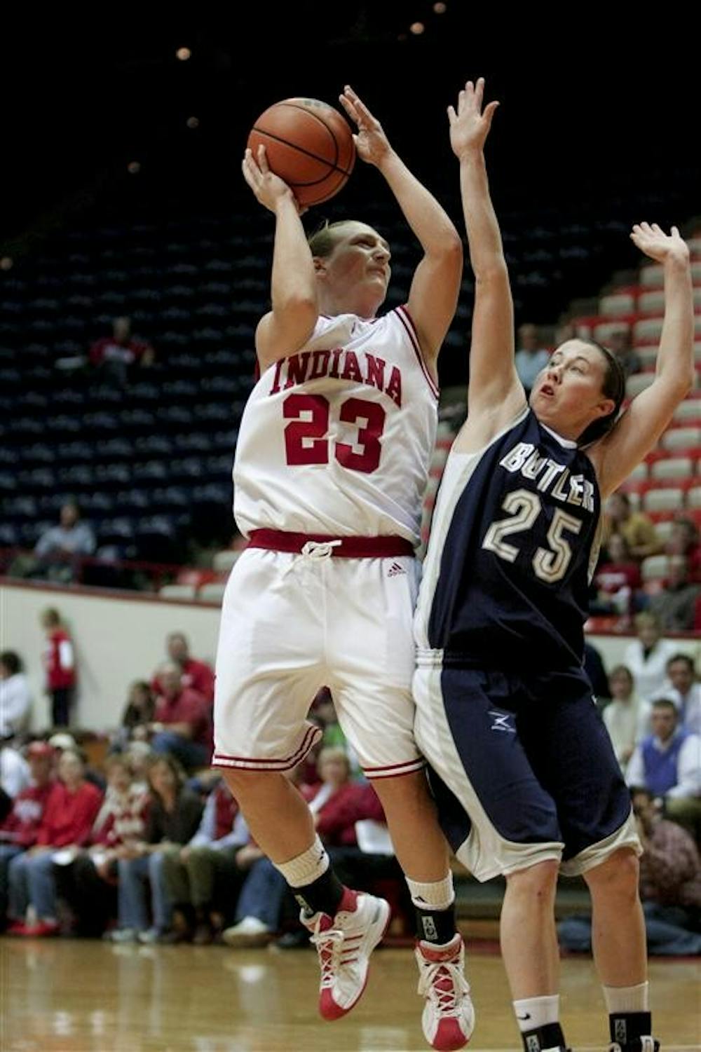 Junior guard Jamie Braun goes for a lay up as Butler's Devin Brierly attemts to block her on Tuesday night. The Hoosier's won 63-41.