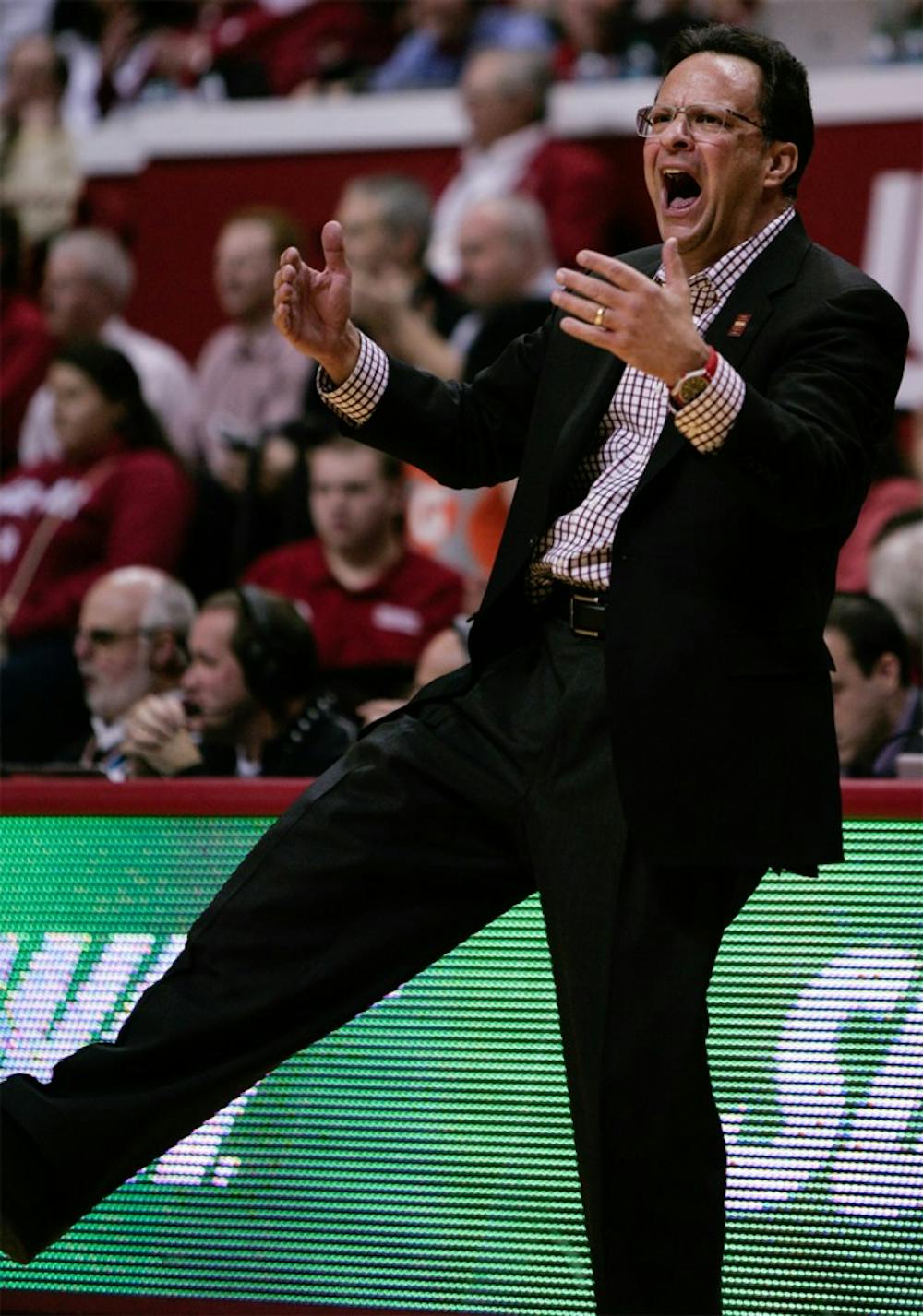 Head coach Tom Crean yells to the crowd to get on their feet to cheer on the Hoosiers Tuesday at Assembly Hall.