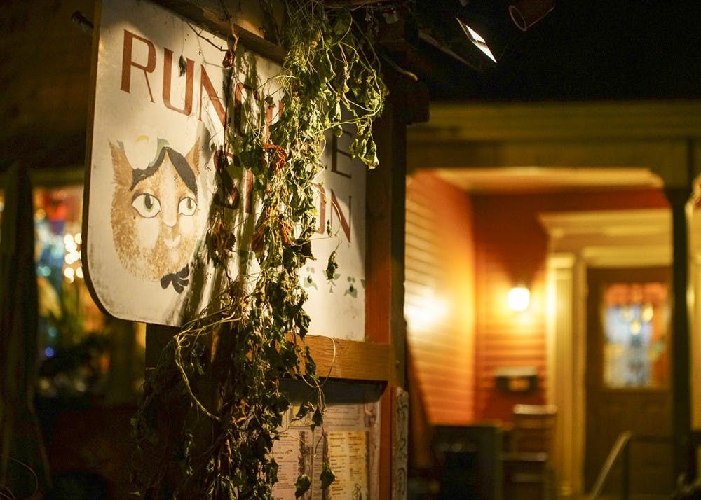 <p>The exterior of the Runcible Spoon is decorated with foliage and lit by subtle lighting. The Runcible Spoon is located on East Sixth Street.</p>