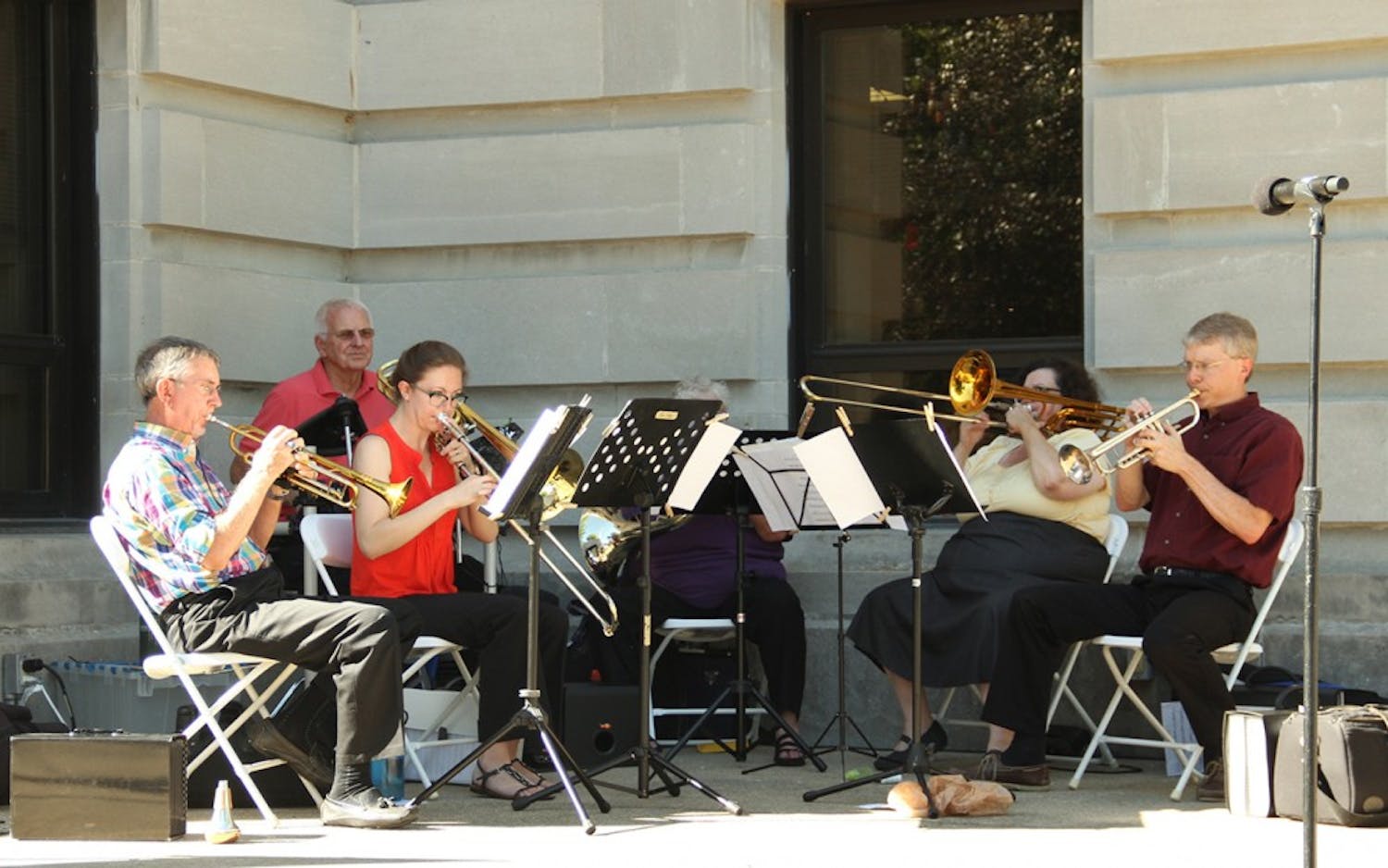 The Bloomington Brass Quintet performs during the Bicentennial Torch Relay Exhibit Tuesday at the Monroe County Courthouse lawn.
