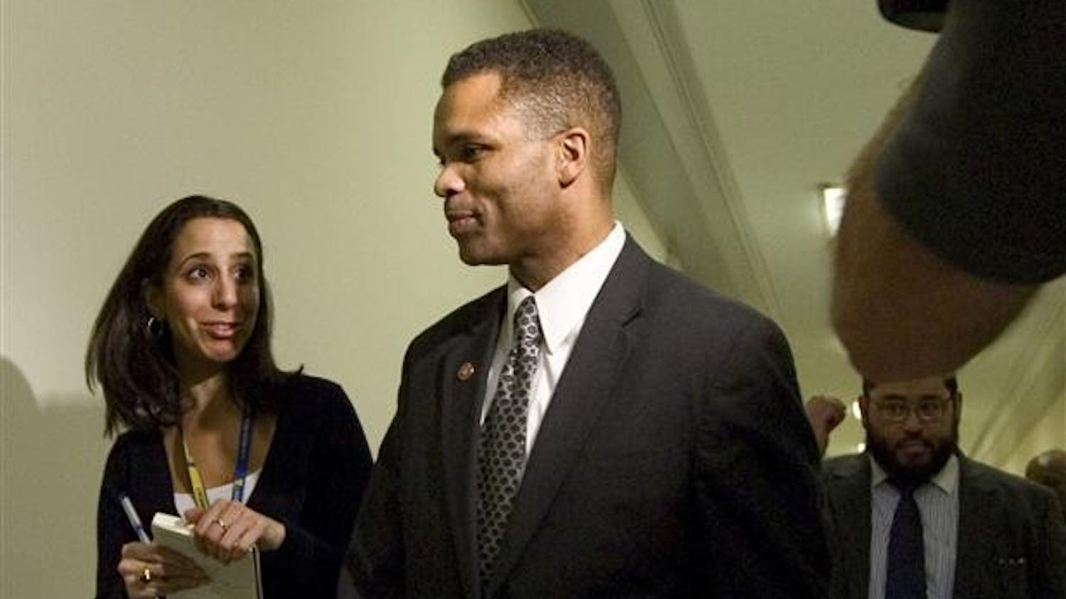 Rep. Jesse Jackson Jr., D-Ill., returns to his office in the Rayburn House Office Building on Capitol Hill after telling reporters he is not a target of the federal investigation of Illinois Gov. Rod Blagojevich, Wednesday in Washington. Wire-tapped conversations indicated that Blagojevich felt that Rep. Jackson could raise campaign money for him in exchange for being appointed to the Senate seat vacated by President-elect Barack Obama. 