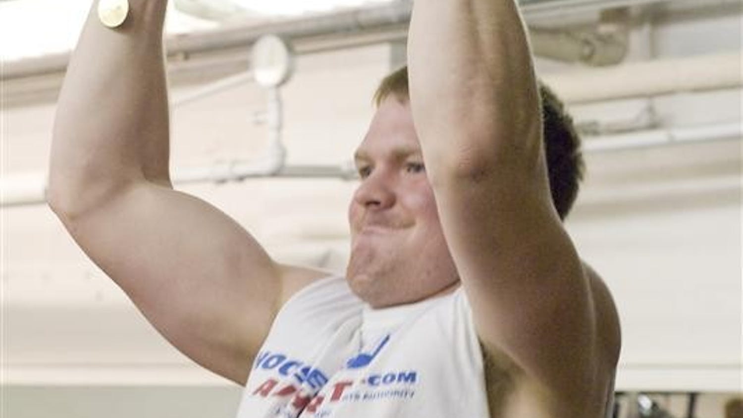 Sophomore Aaron Stobaugh does a pullup at the HPER weight room Wednesday evening.