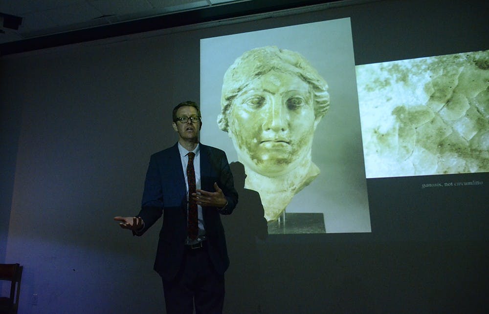 Mark Abbe, assistant professor of ancient art at University of Georgia, speaks at the School of Fine Arts on Tuesday. His lecture was about "recovering the aesthetics of Roman marble sculpture."