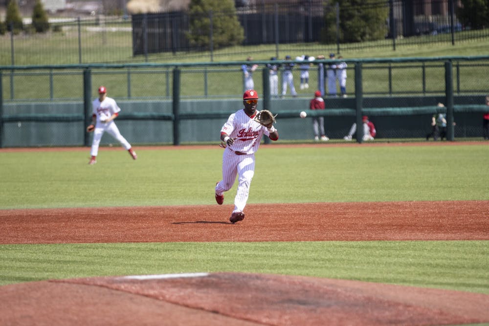 <p>Graduate second baseman Tyler Doanes races to catch a ball against Northwestern on April 2, 2022, at Bart Kaufman Field. Six Indiana baseball players received Big Ten honors Tuesday.</p>