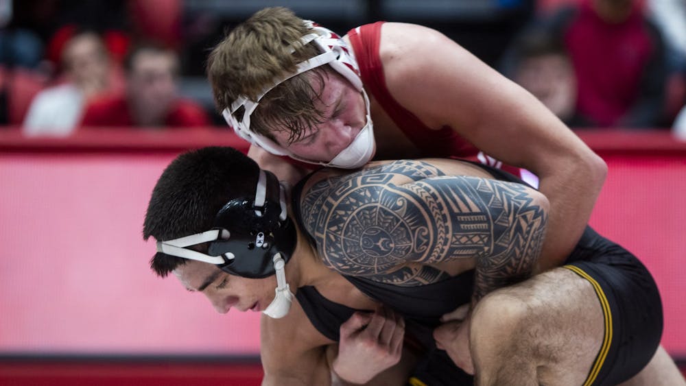 Sophomore Graham Rooks wrestles senior Pat Lugo from the Iowa Hawkeyes Jan. 10 in Wilkinson Hall. IU will compete in the Big Ten Championships this weekend in Piscataway, New Jersey. 