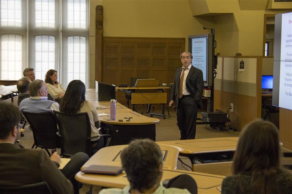Vanderbilt Professor Larry Bartels speaks about political issues during his "Democracy for Realists" lecture on Monday at Woodburn Hall. The lecture was sponsored by the IU Department of Political Science.
