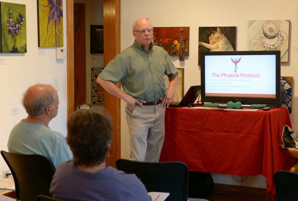 Local therapist Ron Masters talks about suicide prevention at the Fine Art Venue and Gift on Tuesday night.