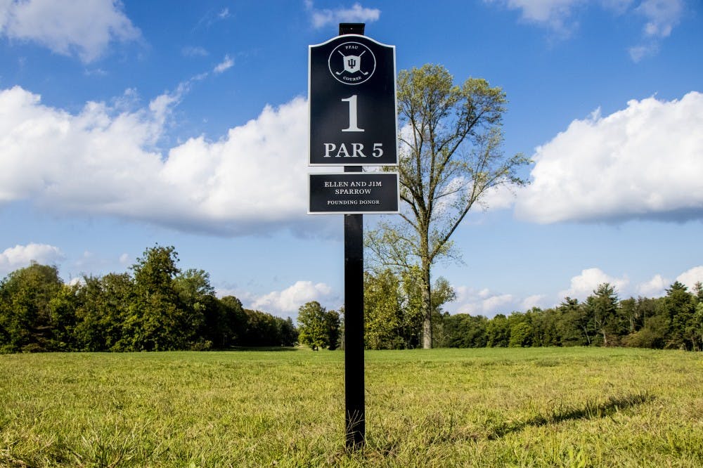 <p>The first hole sign is seen at the Pfau Indiana University Golf Course. IU head coach Mike Mayer said he is hoping to see a more well-rounded tournament this weekend</p>