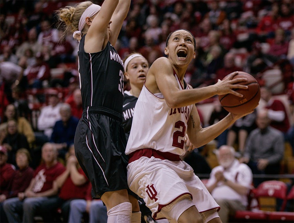 Junior guard Alexis Gassion goes up to the basket to score a layup on Feb. 14 at Assembly Hall. Gassion scored 16 points against Minnesota to help the Hoosiers win 93-79. 