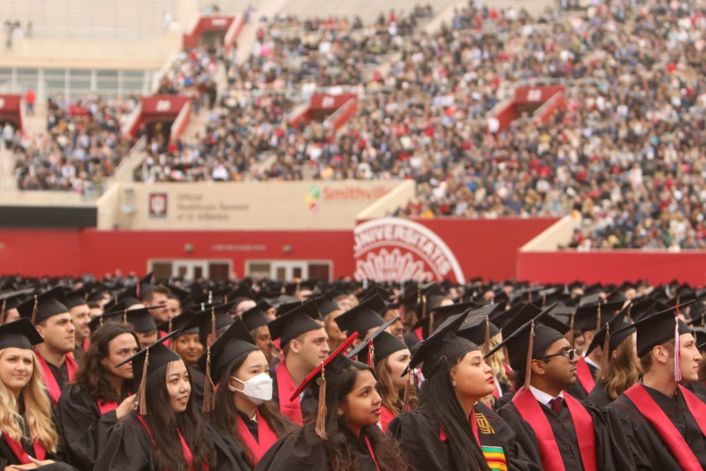 <p>Members of the class of 2022 listen to one of the commencement speakers, CEO of The Walt Disney Company Bob Chapek, on May 7, 2022, in Memorial Stadium. The winter 2022 commencement ceremony will take place at 10 a.m. Dec. 17, 2022, at Simon Skjodt Assembly Hall.</p>