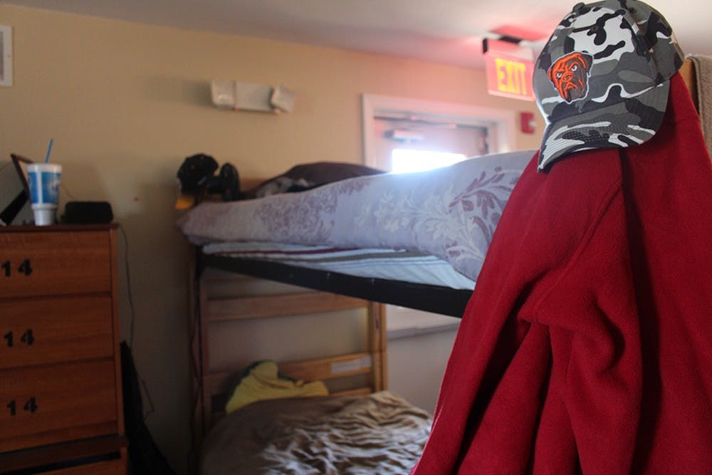 At the Lighthouse, Crafton finally has a bed to sleep in and a place to receive the treatment he sought out for months in jail. Price sleeps on the bunk below him and the few belongings the men have with them at the center either hang from their bed posts or are placed on and inside the drawers beside their bunks. 