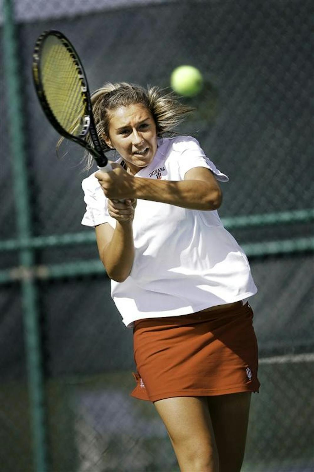 Sophomore Katya Zapadalova powers a backhand across the net during the Hoosier Classic Friday afternoon at the Varsity Tennis Courts.