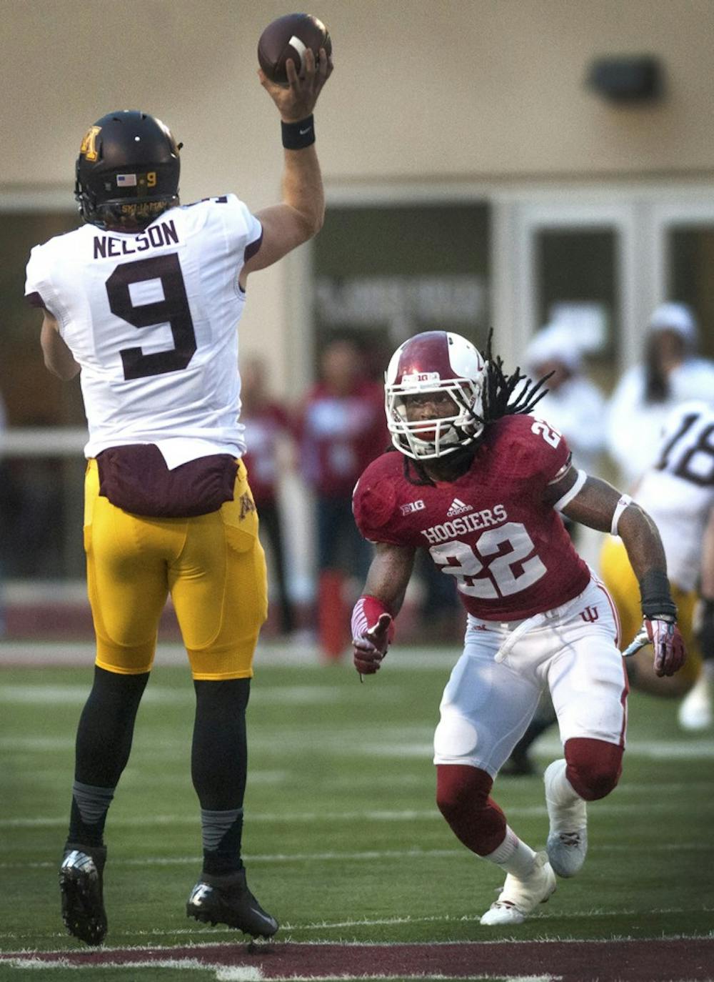 Then-junior cornerback Kenny Mullen pressures Minnesota's quarterback during IU's homecoming game Nov. 2, 2013, at Memorial Stadium.