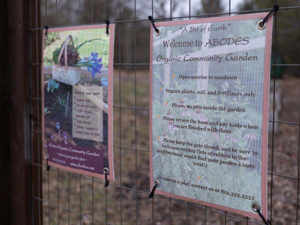 Signs detailing the rules of the Abode Apartments Community Garden are shown Jan. 24, 2023, at the Woods at Latimer apartment complex on South Clarizz Boulevard. The garden is exclusively organic and provides gardening tools for those who need them.