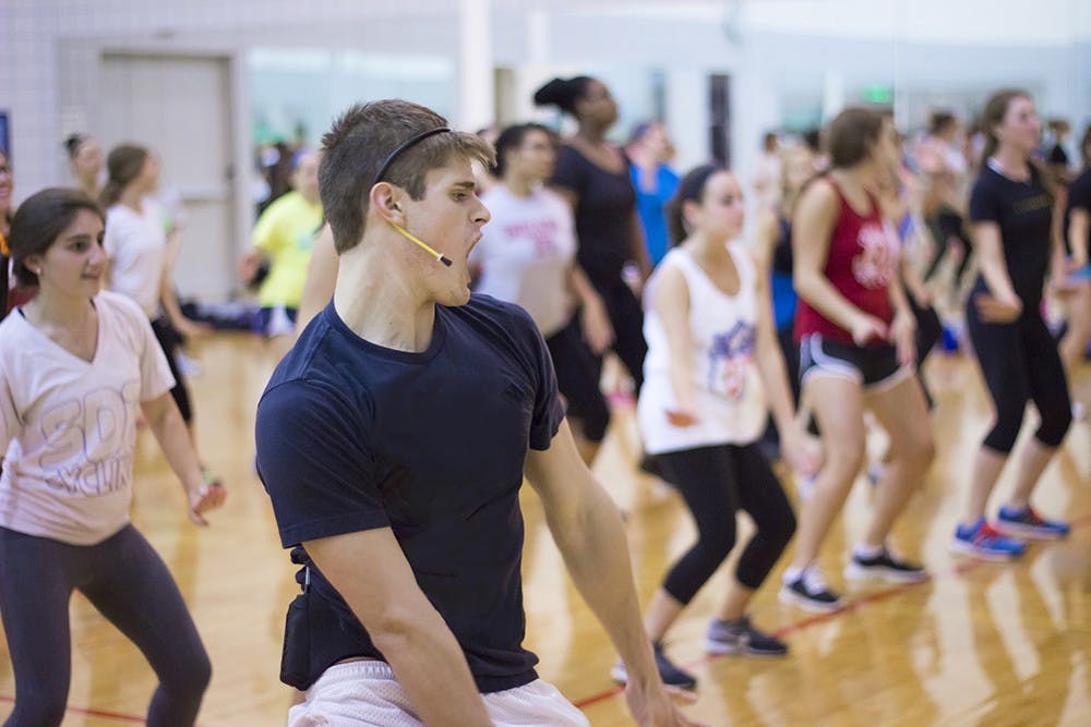 Caleb Marshall leads a Cardio Hip Hop session at the Student Recreational Sports Center in 2014.