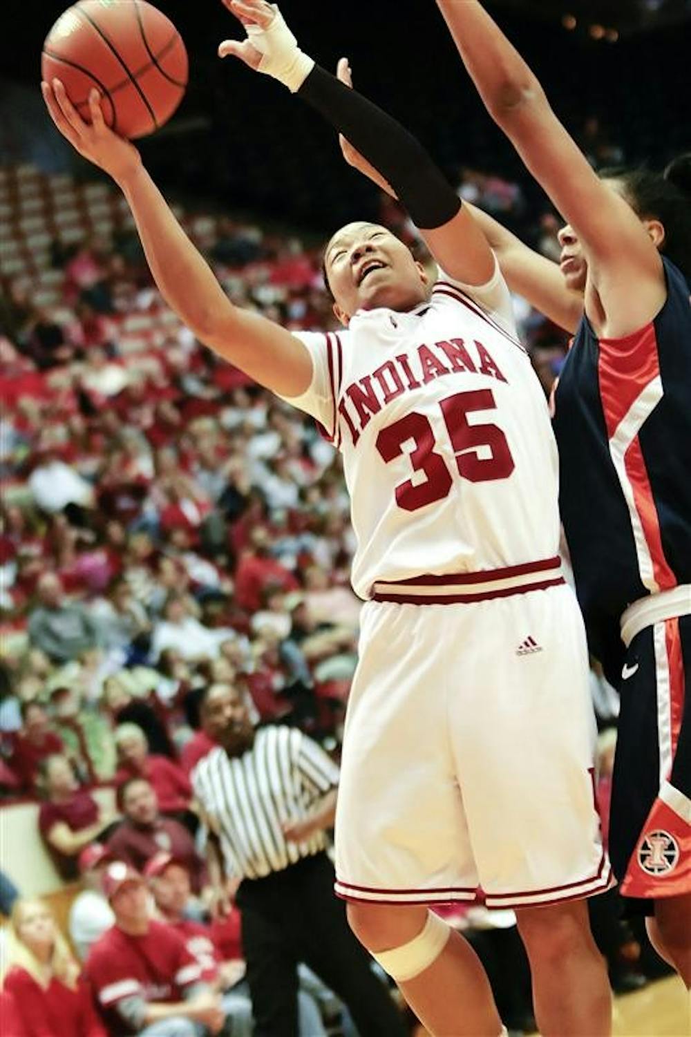 Senior guard Kim Roberson fends off an Illinois defender under the basket during the Hoosiers 66-59 loss to the Illini Feb. 8 at Assembly Hall.