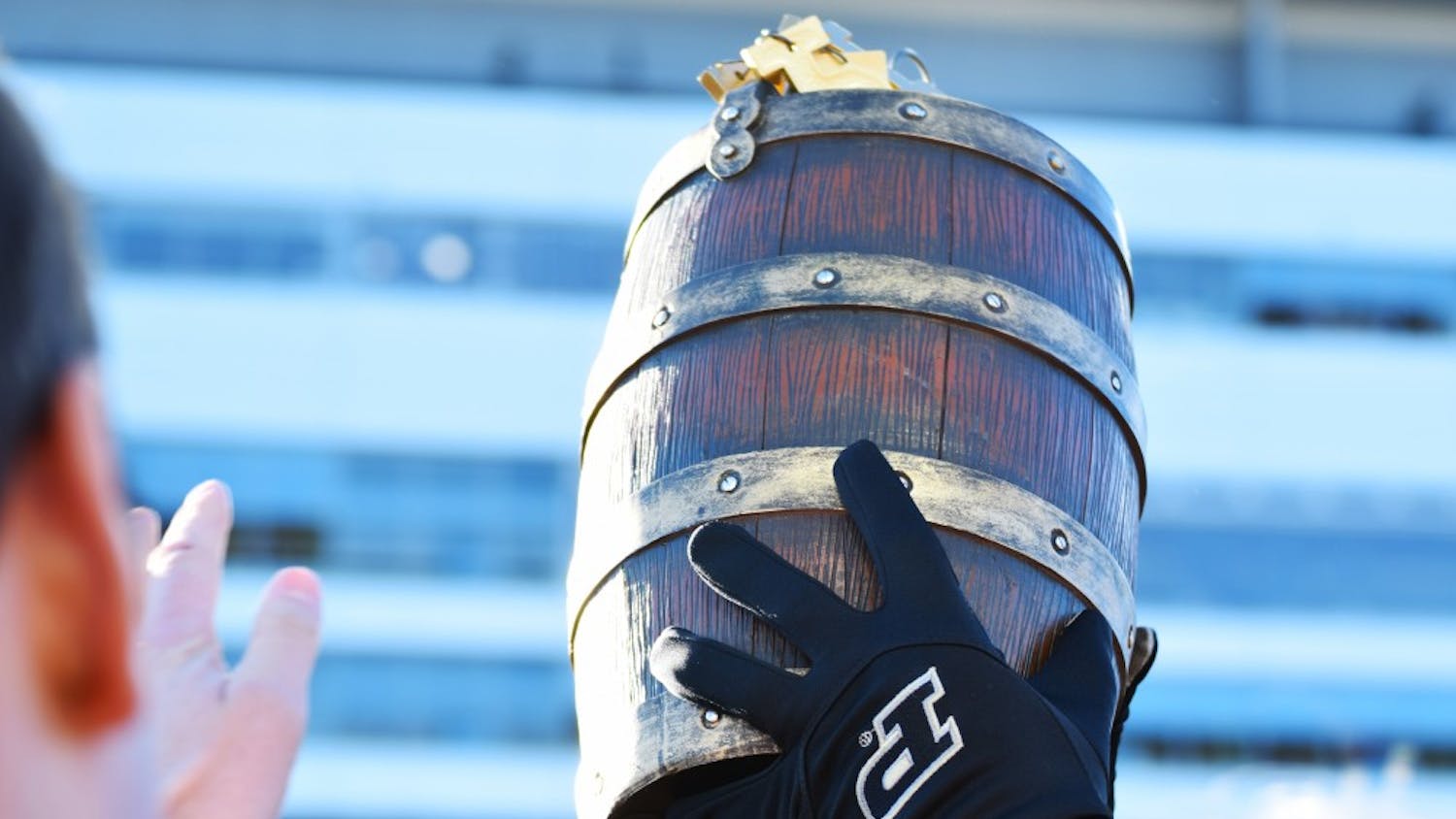 A Purdue team member holds the Old Oaken Bucket Nov. 25 at Ross-Ade Stadium after Purdue defeated IU for the first time since 2012. Both IU and Purdue will need a win in this year's battle to reach a bowl game.
