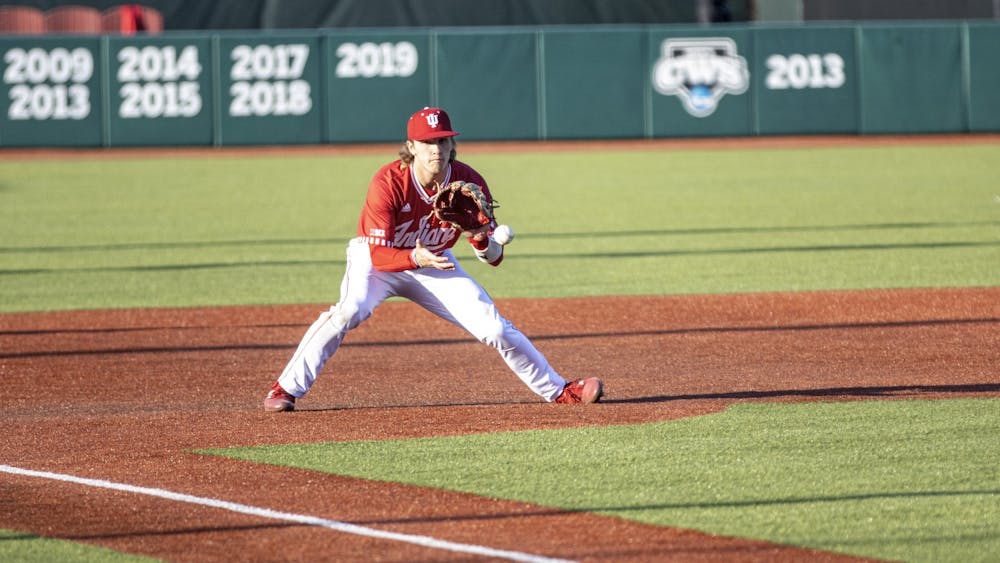 Freshman third basemen Josh Pyne fields a ground ball on the hop during the game against Purdue Fort Wayne on March 9, 2022, at Bart Kaufman Field. IU lost to Rutgers on Sunday morning 2-14, officially ending their season. 